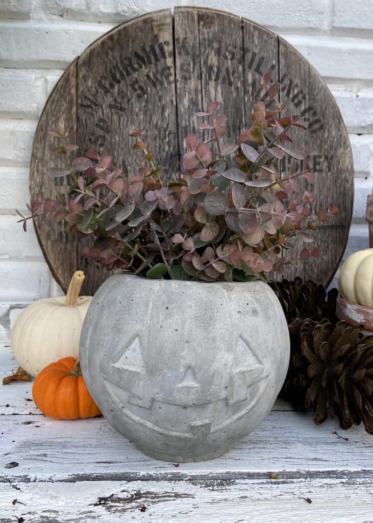 Faux Greenery Concrete Jack-O-Lantern